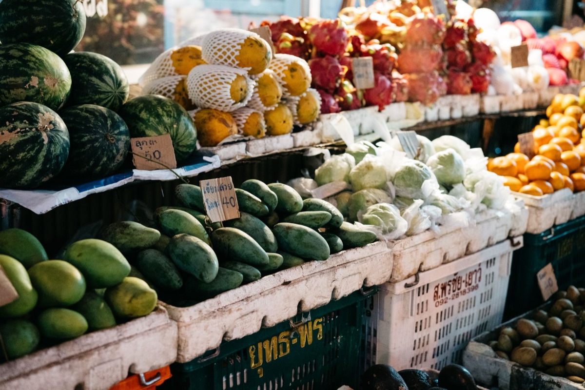 Local market with fresh tropical fruits and seafood